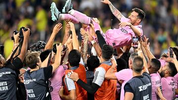 (FILES) Teammates hold up Inter Miami's Argentine forward #10 Lionel Messi as they celebrate after winning the Leagues Cup final football match against Nashville SC at Geodis Park in Nashville, Tennessee, on August 19, 2023. Lionel Messi has been named on December 5, 2023 Time magazine's "Athlete of the Year" for 2023 after a trailblazing season marked by an eighth Ballon d'Or award and his ground-breaking move to Major League Soccer's Inter Miami. (Photo by CHANDAN KHANNA / AFP)